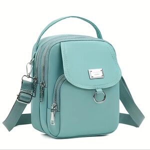 Light Green Crossbody Bag, has adjustable removable crossbody strap~New in pack.